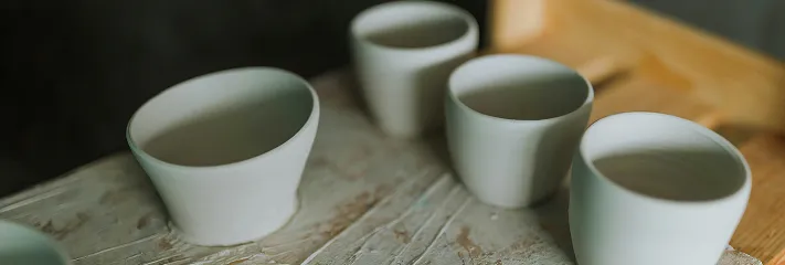 Three empty white cups.
