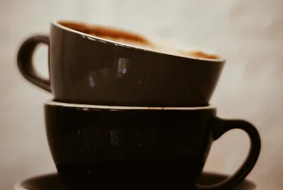 Two brown cups inside each other.