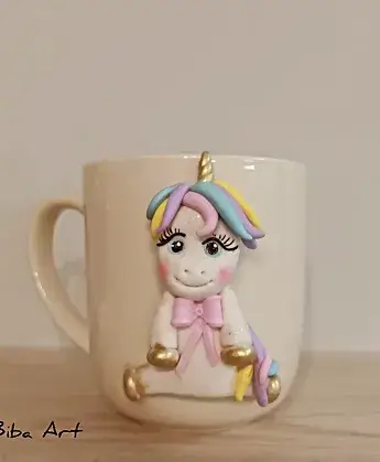 White cup with unicorn on it.
