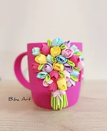 Pink cup with flowers on it.