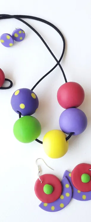 Necklace with four colorfull small balls.