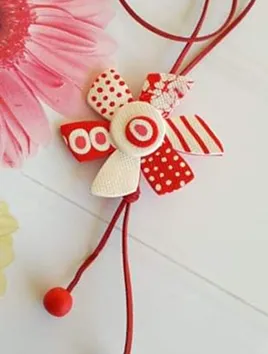 Red, white necklace.