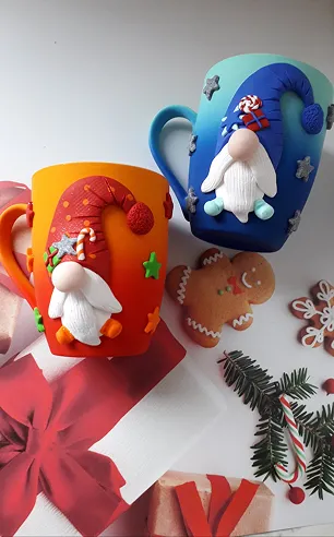 Two cups with Santa Clause on it.