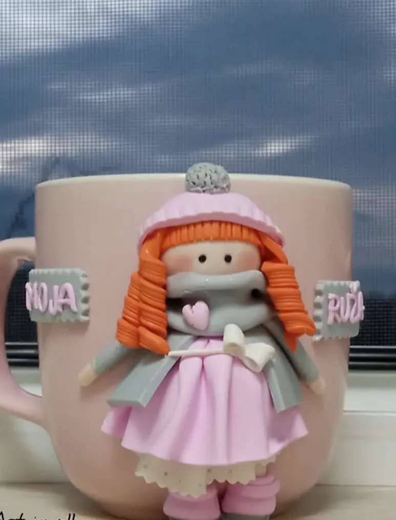 Cup white girl dressed in pink dress on it.
