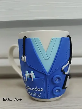 White cup with doctor suit on it.